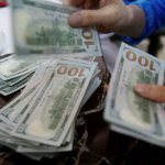 Dollar slides against dong