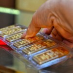 Gold prices slip to near 2-week low