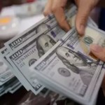 Dollar slips against dong